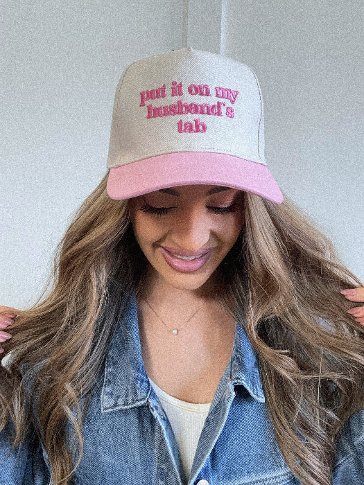 Put it on my husband's tab trucker hat in pink/ivory