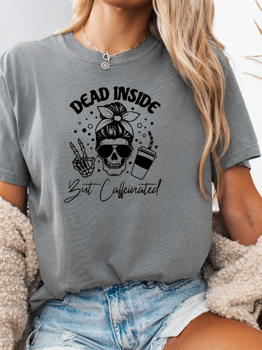 Dead Inside But Caffeinated graphic available as a tee, crewneck, or sweatshirt featuring a fun coffee-inspired design on soft cotton-blend fabric, perfect for Halloween, spooky season, and everyday fall outfits. TShirt in Grey