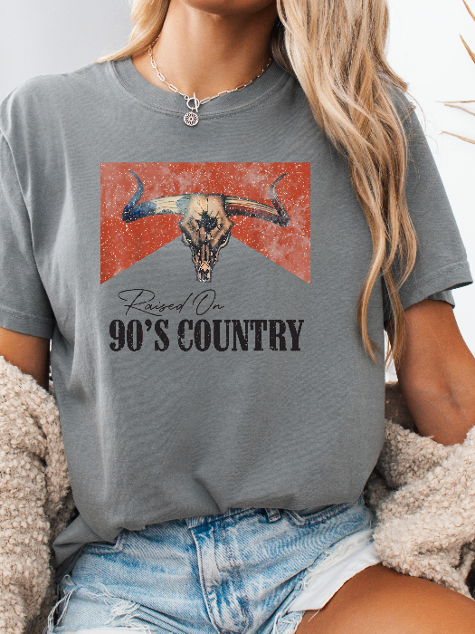 Raised On 90's Country Graphic Tee printed on premium Comfort Colors cotton, featuring an exclusive Willow Boutique design perfect for country concerts, rodeos, and everyday western-inspired style. Tshirt in Grey