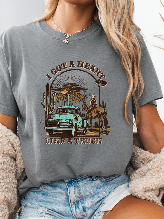 Heart Like A Truck Graphic Tee featuring an exclusive Willow Boutique country-inspired design on soft 100% cotton, perfect for country concerts, rodeos, Nashville trips, and everyday western style. Tshirt in Grey