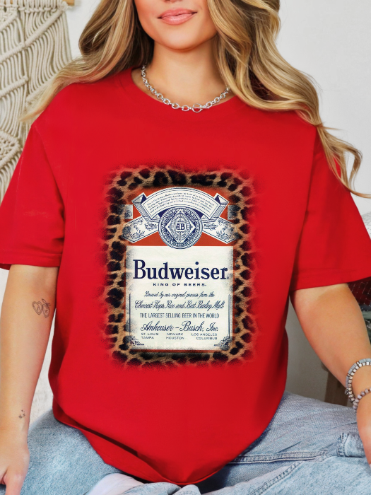 King of Beers Graphic Tee made from soft 100% cotton featuring a vintage-inspired beer graphic, perfect for tailgates, BBQs, brewery visits, country concerts, and casual everyday style. Color Red