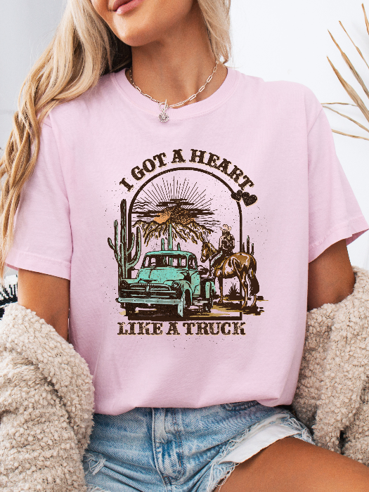 Heart Like A Truck Graphic Tee featuring an exclusive Willow Boutique country-inspired design on soft 100% cotton, perfect for country concerts, rodeos, Nashville trips, and everyday western style. Tshirt in Light Pink