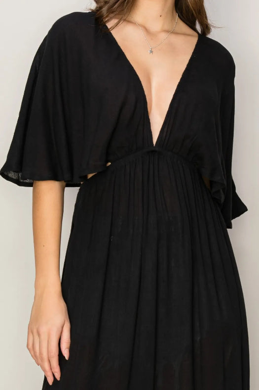 Woman wearing HYFVE Tie Back Maxi Split Cover Up Dress with plunging neckline and side slit maxi skirt