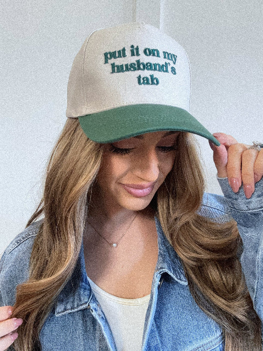 Put it on my husband's tab trucker hat in green/ivory