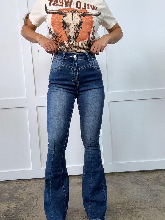 Keep Up Flare Dark Wash Jeans featuring Willow Boutique's exclusive V-Cross waistband, high-rise fit, mega stretch denim, frayed hem, and dramatic flare leg for a flattering boutique look.