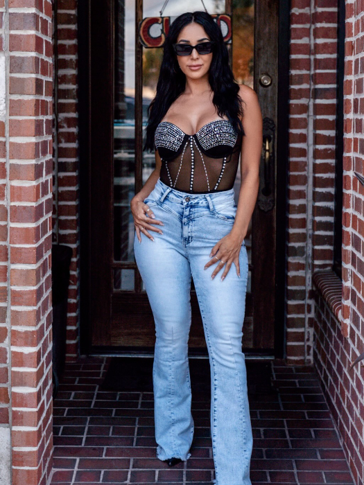 Keep Up Flare Acid Wash Jeans featuring Willow Boutique's exclusive V-Cross waistband, high-rise fit, mega stretch denim, frayed hem, and dramatic flare leg for a flattering boutique look.
