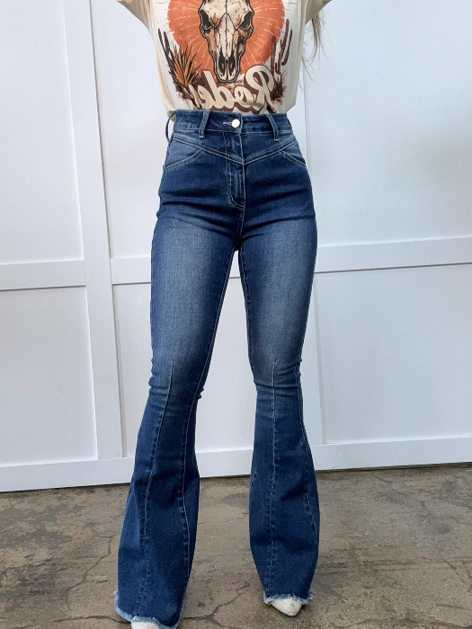 Keep Up Flare Dark Wash Jeans featuring Willow Boutique's exclusive V-Cross waistband, high-rise fit, mega stretch denim, frayed hem, and dramatic flare leg for a flattering boutique look.