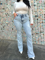 Keep Up Flare Acid Wash Jeans featuring Willow Boutique's exclusive V-Cross waistband, high-rise fit, mega stretch denim, frayed hem, and dramatic flare leg for a flattering boutique look.