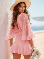 Hope Ruffle Hem Lace Mini Dress featuring delicate lace detailing, a flowy silhouette, feminine ruffle hem, and adjustable tie-back design, perfect for weddings, bridal showers, vacations, and spring or summer occasions. Color Blush pink