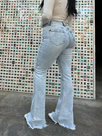 Keep Up Flare Acid Wash Jeans featuring Willow Boutique's exclusive V-Cross waistband, high-rise fit, mega stretch denim, frayed hem, and dramatic flare leg for a flattering boutique look.