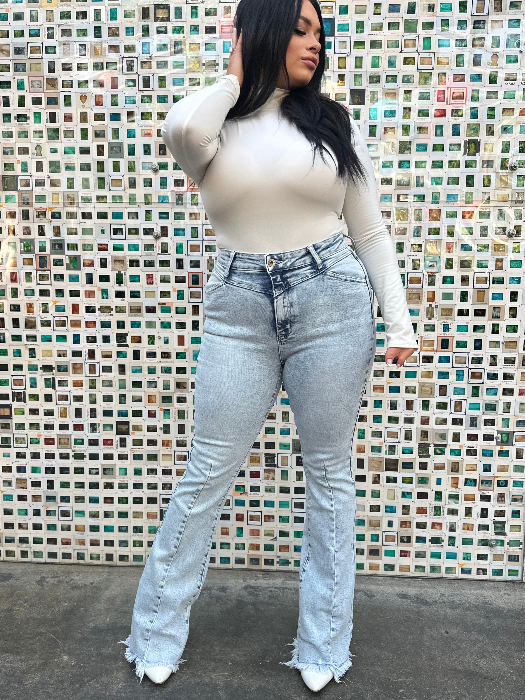 Keep Up Flare Acid Wash Jeans featuring Willow Boutique's exclusive V-Cross waistband, high-rise fit, mega stretch denim, frayed hem, and dramatic flare leg for a flattering boutique look.