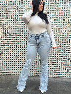 Keep Up Flare Acid Wash Jeans featuring Willow Boutique's exclusive V-Cross waistband, high-rise fit, mega stretch denim, frayed hem, and dramatic flare leg for a flattering boutique look.