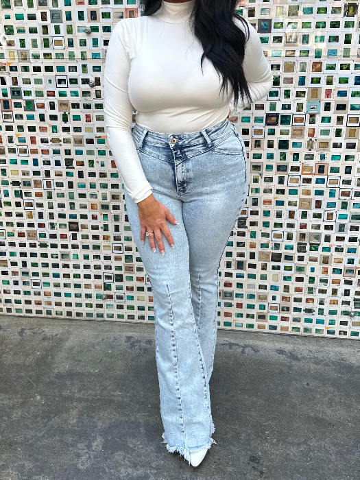 Keep Up Flare Acid Wash Jeans featuring Willow Boutique's exclusive V-Cross waistband, high-rise fit, mega stretch denim, frayed hem, and dramatic flare leg for a flattering boutique look.