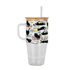 Black Cats on Books drinkware design featuring whimsical black cats lounging on colorful stacks of books with pastel flowers and bookish details.