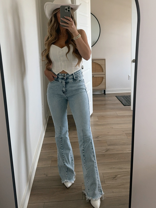 Keep Up Flare Acid Wash Jeans featuring Willow Boutique's exclusive V-Cross waistband, high-rise fit, mega stretch denim, frayed hem, and dramatic flare leg for a flattering boutique look.