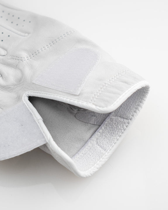 Pins & Aces Premium Tour Ghost White unisex golf glove made from 100% premium AAA Cabretta leather with moisture-wicking wrist lining and men’s standard sizing.