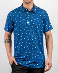 Men’s South Park Classic golf polo by Pins & Aces featuring a blue base with a colorful all-over South Park-themed print, short sleeves, and athletic performance fit.