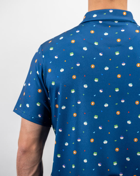 Men’s South Park Classic golf polo by Pins & Aces featuring a blue base with a colorful all-over South Park-themed print, short sleeves, and athletic performance fit.