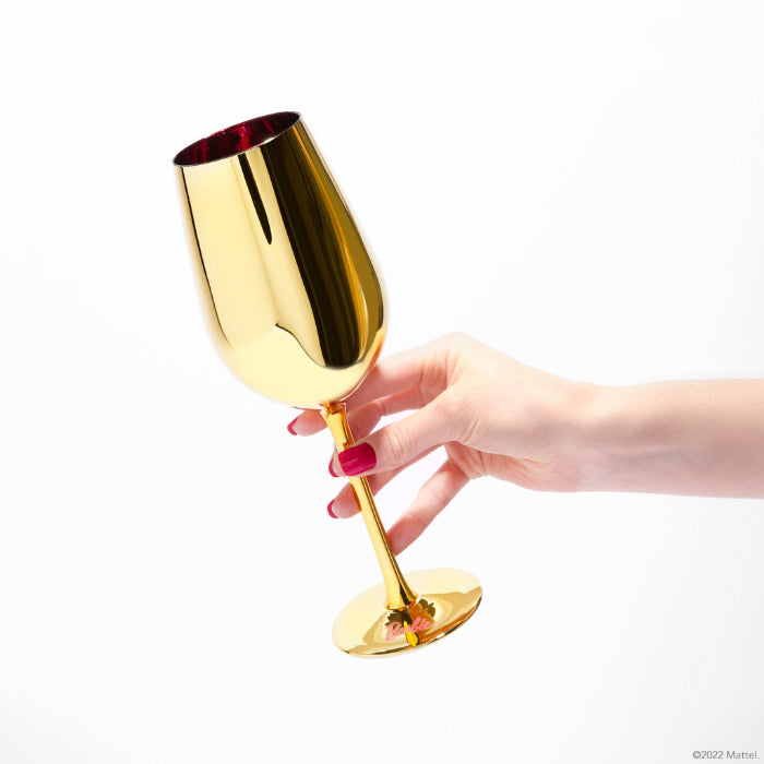 Set of two Barbie™ x Dragon Glassware® Dreamhouse™ 17.5 oz stemmed wine glasses with metallic gold exteriors, pink interiors, Barbie™ logo bases, and pink gift box.