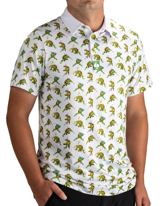 White TMNT Cowabunga Classic 8-Bit golf polo by Pins & Aces featuring an all-over retro pixel-style Teenage Mutant Ninja Turtles character print.