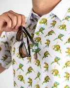 White TMNT Cowabunga Classic 8-Bit golf polo by Pins & Aces featuring an all-over retro pixel-style Teenage Mutant Ninja Turtles character print.