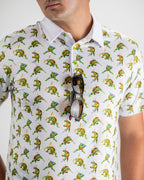 White TMNT Cowabunga Classic 8-Bit golf polo by Pins & Aces featuring an all-over retro pixel-style Teenage Mutant Ninja Turtles character print.