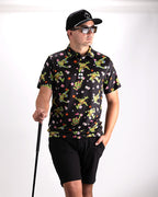 Black TMNT Turtle Flower Power golf polo by Pins & Aces featuring colorful Teenage Mutant Ninja Turtles characters and floral print.