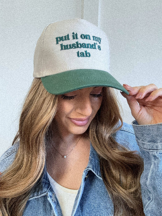Put it on my husband's tab trucker hat in green/ivory