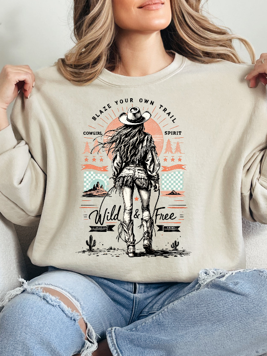 Women’s Blaze Your Own Trail Western graphic tee featuring an original Willow Boutique cowgirl design on a relaxed-fit Comfort Colors® 100% cotton Crewneck in Ivory