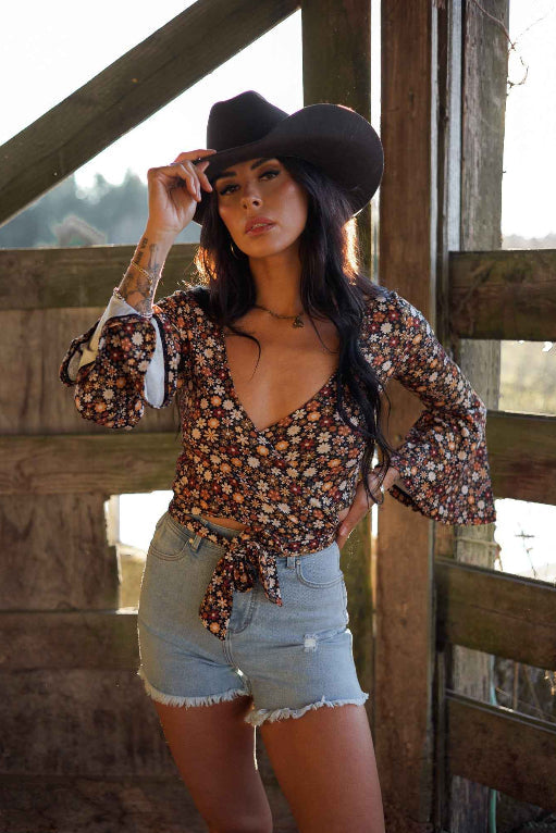 Brooke High Waisted Denim Shorts featuring a flattering high-rise waist, premium stretch denim, subtle distressed details, classic five-pocket styling, and a frayed hem for an effortless boutique summer look. Comes in a Light Wash