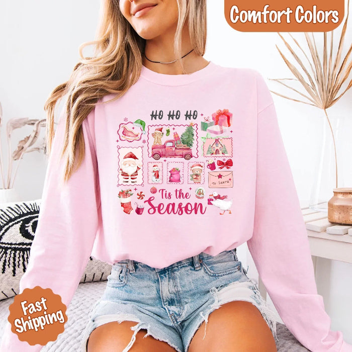 Comfort Colors Ho Ho Ho ’Tis The Season long sleeve Christmas shirt featuring a festive holiday graphic on a relaxed garment-dyed 100% cotton tee in Light Pink