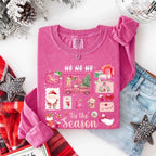 Comfort Colors Ho Ho Ho ’Tis The Season long sleeve Christmas shirt featuring a festive holiday graphic on a relaxed garment-dyed 100% cotton tee in Crunchberry