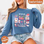 Comfort Colors Ho Ho Ho ’Tis The Season long sleeve Christmas shirt featuring a festive holiday graphic on a relaxed garment-dyed 100% cotton tee in Blue Jean