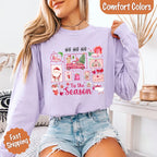 Comfort Colors Ho Ho Ho ’Tis The Season long sleeve Christmas shirt featuring a festive holiday graphic on a relaxed garment-dyed 100% cotton tee in Orchid