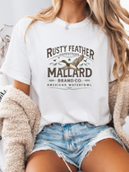 Rusty Feathered Mallard Graphic Tee printed on premium Comfort Colors 100% cotton featuring a detailed vintage-inspired mallard duck design, perfect for outdoor adventures, lake weekends, and casual country style. Tshirt in White