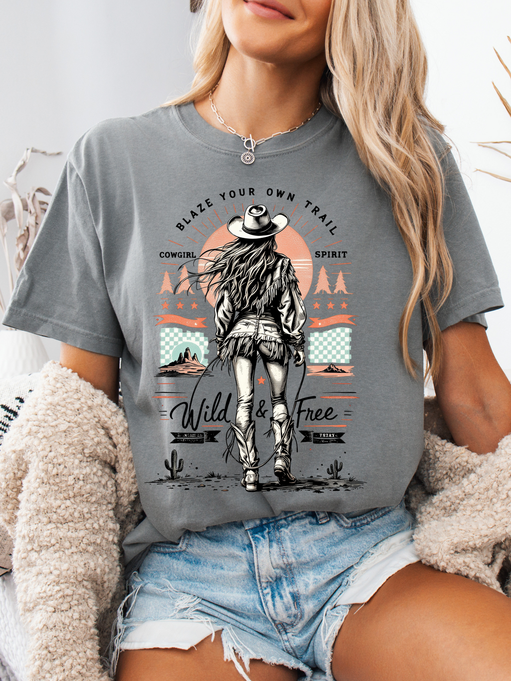 Women’s Blaze Your Own Trail Western graphic tee featuring an original Willow Boutique cowgirl design on a relaxed-fit Comfort Colors® 100% cotton T-shirt in Grey