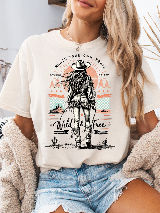 Women’s Blaze Your Own Trail Western graphic tee featuring an original Willow Boutique cowgirl design on a relaxed-fit Comfort Colors® 100% cotton T-shirt in Ivory