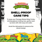 Set of four officially licensed Teenage Mutant Ninja Turtles 16-ounce glass drinking cups featuring Leonardo, Donatello, Michelangelo, and Raphael with reusable lids and straws.