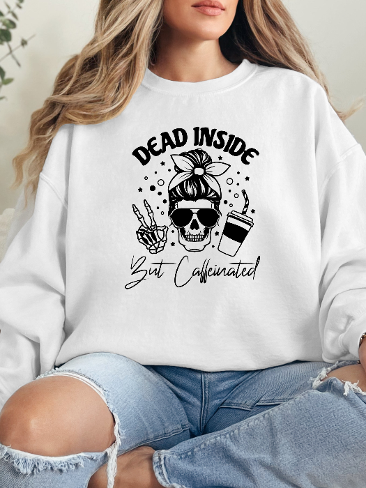 Dead Inside But Caffeinated graphic available as a tee, crewneck, or sweatshirt featuring a fun coffee-inspired design on soft cotton-blend fabric, perfect for Halloween, spooky season, and everyday fall outfits. Crewneck in White