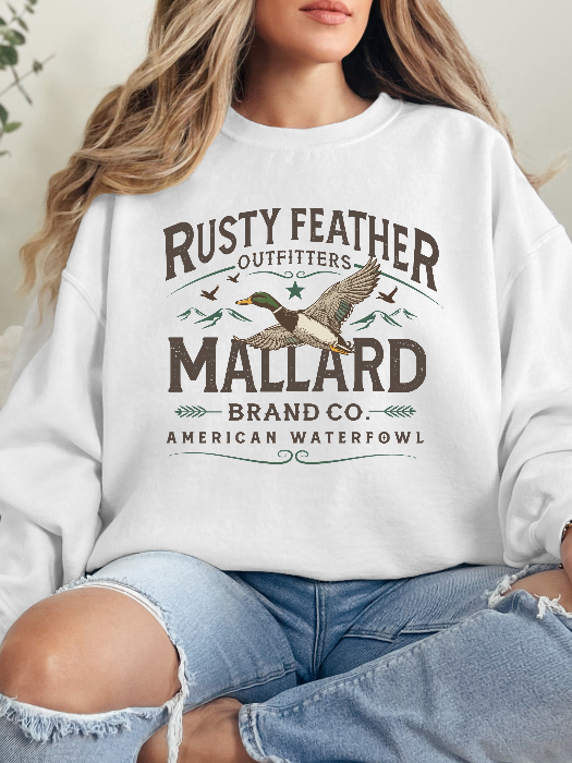 Rusty Feathered Mallard Graphic Tee printed on premium Comfort Colors 100% cotton featuring a detailed vintage-inspired mallard duck design, perfect for outdoor adventures, lake weekends, and casual country style. Crewneck in White