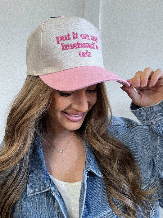Put it on my husband's tab trucker hat in pink/ivory
