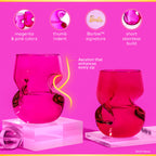 Two Barbie™ x Dragon Glassware® 16-ounce stemless wine glasses in pink and magenta with sculptural curved sides, displayed in front of a bright pink Barbie™ gift box.