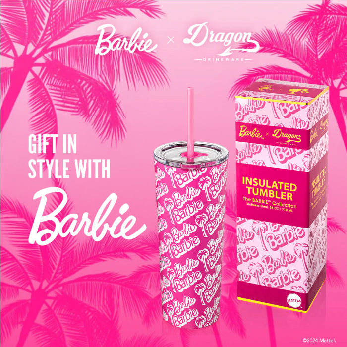 Barbie x Dragon insulated tumbler with packaging on a pink background with palm trees.