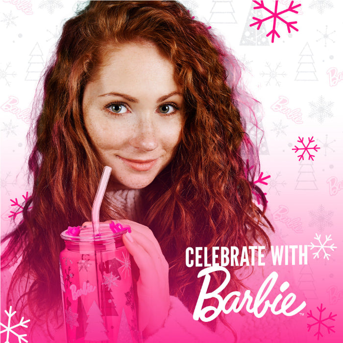 Set of two officially licensed Barbie™ Christmas 20 oz drinking glasses by Dragon Glassware in pink and clear designs with holiday trees, snowflakes, lids, glass straws, and gift box.