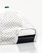 White Pins & Aces Fishing Lure perforated rope golf hat with fishing-inspired design, adjustable snapback, magnetic ball marker holder, and matching golf ball marker.