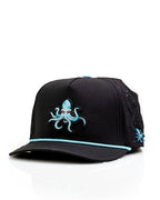 Kraken Black perforated rope golf hat by Pins & Aces featuring an all-black design, braided rope accent, breathable perforated panels, adjustable snapback, and built-in magnetic golf ball marker holder.