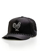 Black Pins & Aces perforated rope golf hat featuring an embroidered rooster on the front, breathable side panels, rope detail, and adjustable snapback design.