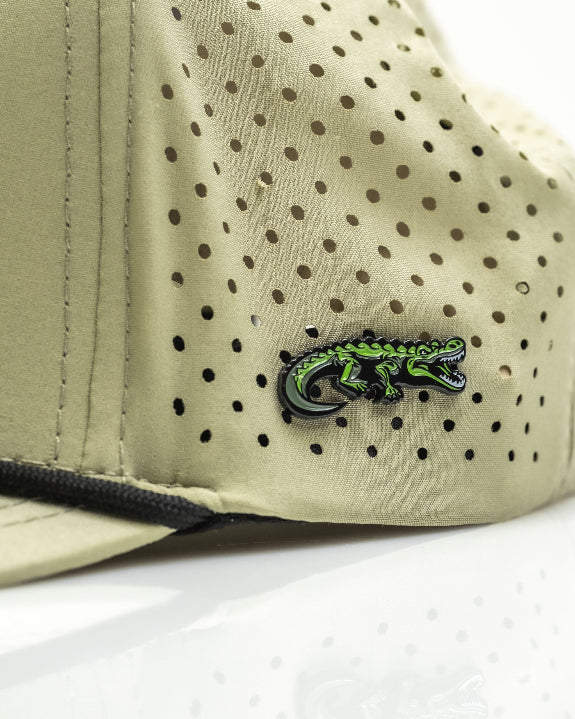 Gator Olive perforated rope golf hat by Pins & Aces featuring an olive green design, breathable perforated panels, adjustable snapback, and built-in magnetic golf ball marker holder.