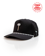 Thor’s Hammer Black perforated rope golf hat by Pins & Aces featuring a hammer-inspired design, adjustable snapback, breathable perforations, and built-in magnetic ball marker holder.