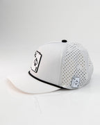 Ace/King White perforated rope golf hat by Pins & Aces with an adjustable snapback, built-in magnetic ball marker holder, and matching golf ball marker.